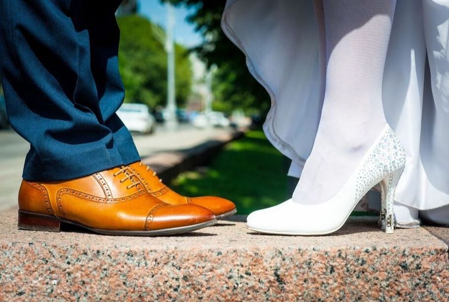Bride and groom's showing off their style with their fancy shoes